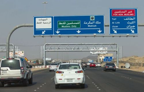 “Entry to the holy city is granted exclusively to the followers of Islam. A road sign on the highway