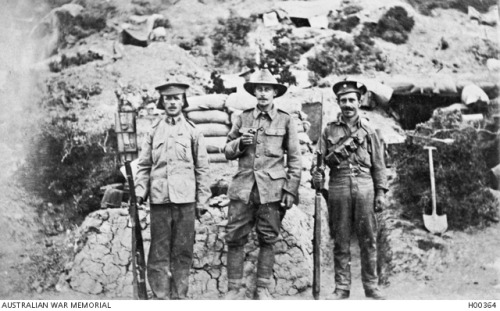 scrapironflotilla: An unidentified Australian soldier flanked by two armed British soldiers. A secon