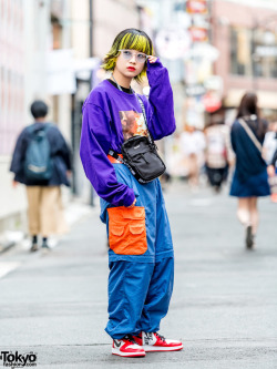 tokyo-fashion:  20-year-old Japanese fashion student Neo Tokyo on the street in Harajuku wearing an O.U.T. Tokyo “Bonfire” sweatshirt with vintage track pants, Nike Air Jordans, and a Supreme crossbody bag. Full Look