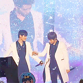 Myungsoo pats Sungjong’s hair for attention, and Jongie stretches his hand out to Myungie with