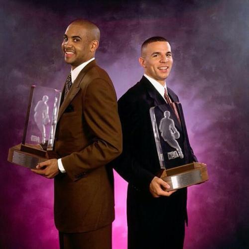 Photo of Jason Kidd and Grant Hill holding their co-Rookie of the Year trophies in 1995. Grant Hill 