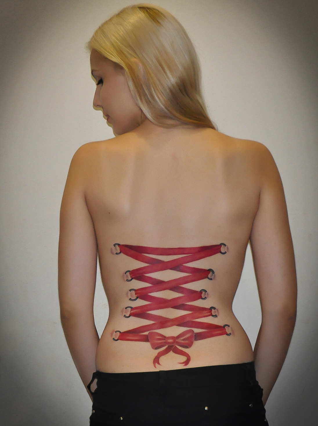 fuckyeahtattoos:  Corset tattoo done by Milton Reis at Electric Ink Tattoo Studio,