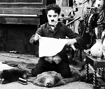 filmforfancy:  Charlie plays barber to a bearskin in Behind the Screen (1916).