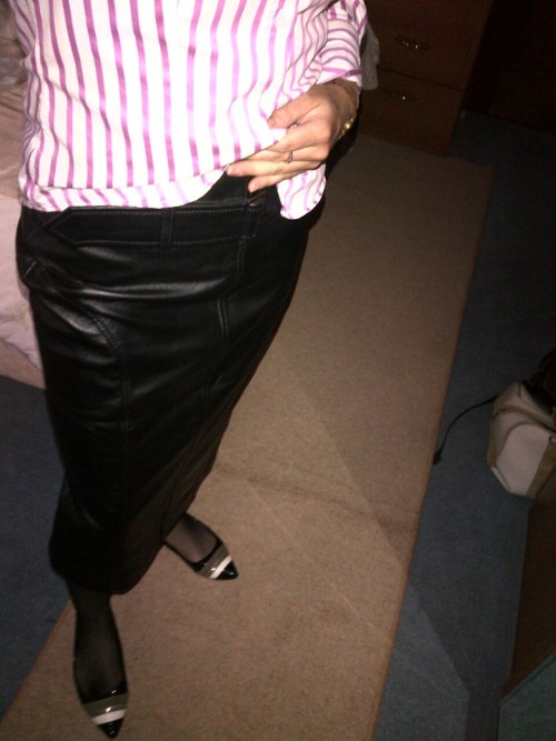 whipmeveryhard:A nice leather skirt and fishnet stockings for work today should have the boys’ cocks