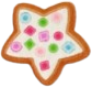 sticker of a gingerbread cookie shaped like a star and decorated with white frosting and polka dots.