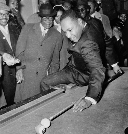 Martin Luther King Jr. attempting a trick shot.