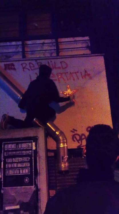 Solidarity graffiti for Libertatia, a squatted anarchist social centre in Thessaloniki, which was to