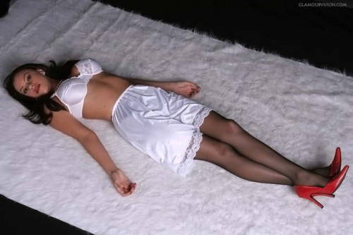 Can’t you imagine just lying there wearing that lovely white bra perfect half slip black stockings a