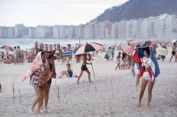 natgeofound:Sunbathers run for cover from a summer rain shower in Rio de Janiero, September 1962.Photograph by Winfield Parks, National Geographic