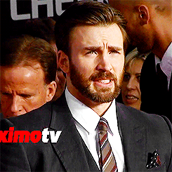 plantbucky:aryahs:Chris Evans being bothered by the camera flashes at the world premiere of Captain America: The Winter Solder. (x)#oh my god this is why he makes that fucking face (via)