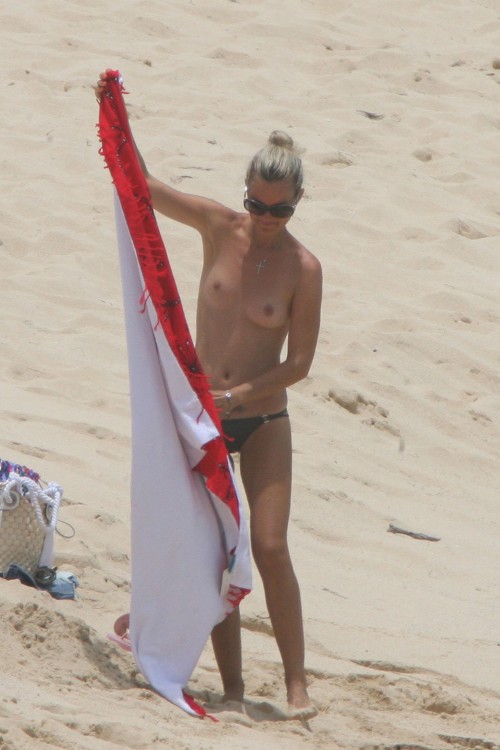 toplessbeachcelebs:  Laeticia Hallyday (Model) sunbathing topless on the beach (August 2009) 