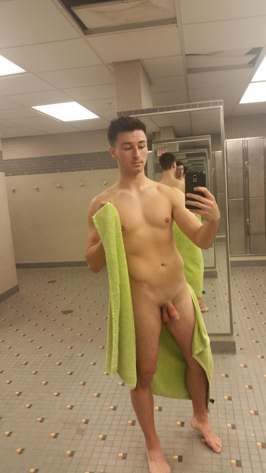 men-photos:  bareandshare: Nude guy taking a selfie in a locker room exhibitionisten-exhibitionists