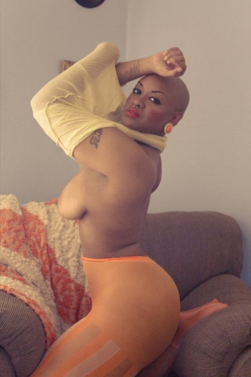 asubmissiveintraining:  nottamodel:  These photos were shot in my home. I love these orange ottomans, which serves as the accent color of my home. I saw these great orange tights while shopping online and new I had to have them. GO LIKE FAN PAGE. TRYING