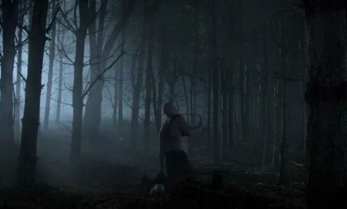 Hemlock Grove S02E01A slightly heavy, bald man flogs himself in a forest.