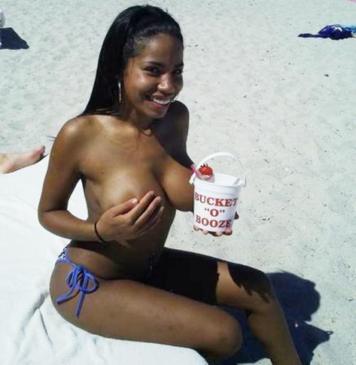 XXX Ebony smiling lady in white sanded beach photo