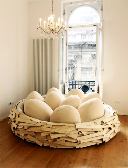 designed-for-life:  Unusual and creative bed designed by OGE looks like a giant bird’s nest. A comfortable informal and sensual soft space. The wooden nest is filled with highly comfortable egg-shaped sitting poofs which allow ergonomic sitting positions