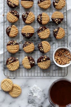 confectionerybliss:  Chocolate-Dipped Crisp Peanut Butter Cookies | Joy The Baker