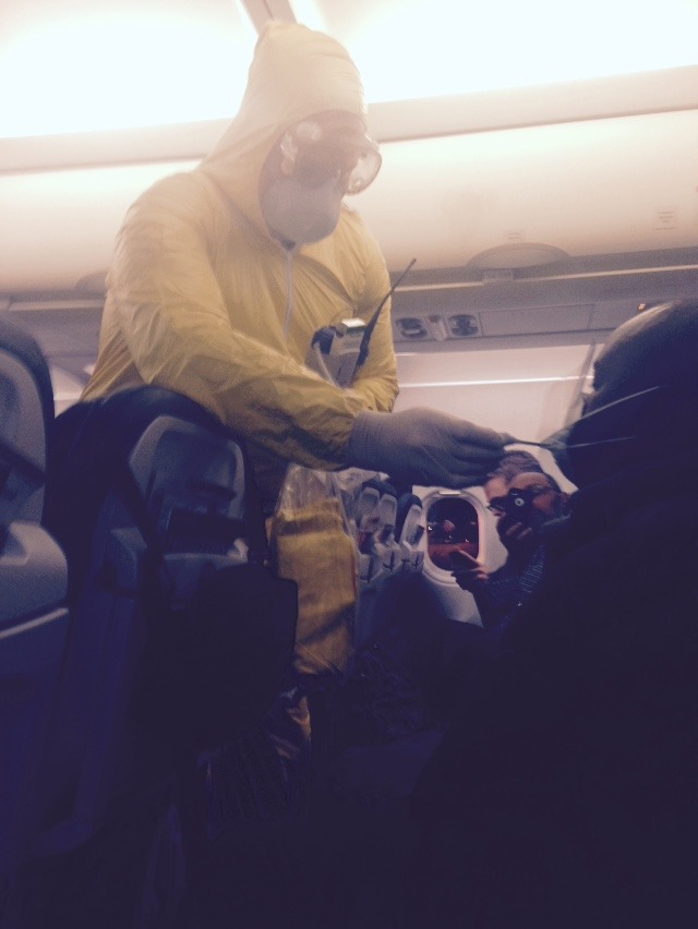 stunningpicture:  Guy with a headache was just escorted off the plane by hazmat here