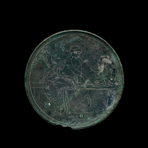 centuriespast:Bronze mirror case with Aphrodite and PanCorinthian, around 350 BCSaid to be from Cori