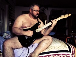 sleepycub34:  kabutocub:  remixcub:  Clif  The hubby, his guitar, and not much else ;)  Always reblog this hottie