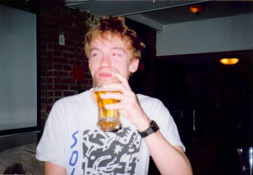 i-pomegranate:  AHA! Y’all thought I was gonna upload a nude for my 500th, well guess again! Here I am in my favourite Irish pub finishing off a black velvet. Note the mint coloured nails, and Casio calculator watch. Shirt designed by local Montreal