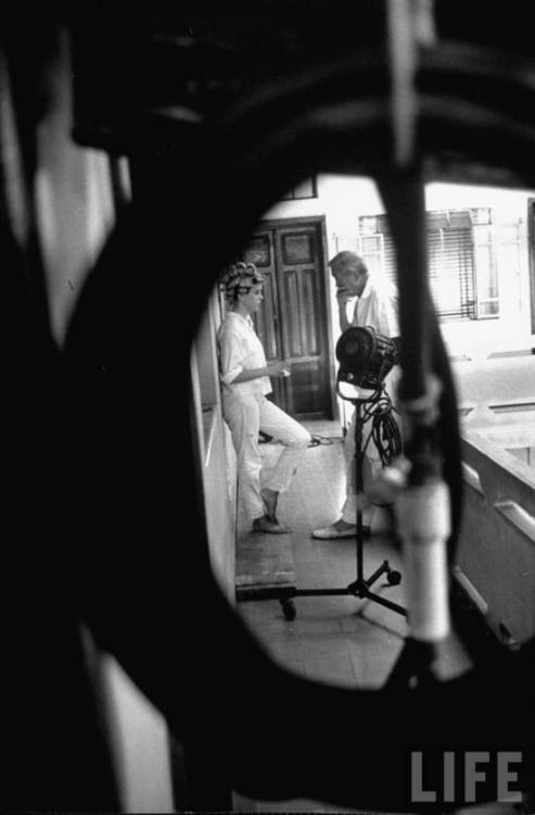 Director John Huston and Sue Lyon on the set of The night of the iguana, 1964. Photo by Gjon Mili.