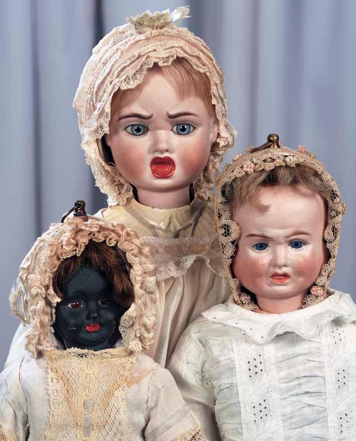 antique three faced dolls
