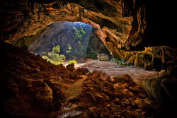 sixpenceee:Phraya Nakhon Cave (Thailand)Inside the Khao Sam Roi Yot National Park is the Phraya Nakhon, an incredible cave with an interesting history behind it. Sunlight filters through the top of the structure’s collapsed ceiling, illuminating the