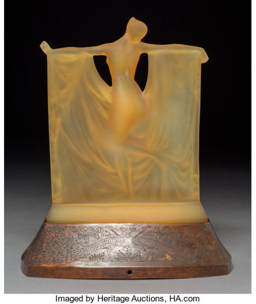 the1920sinpictures:1925 c. Rene Lalique amber glass “Suzanne” statuette on a bronze peacock-decorate