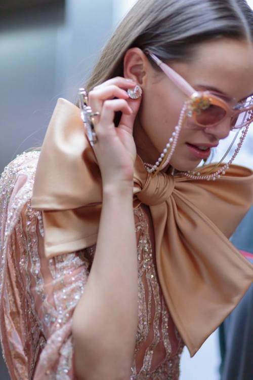  Couture eyewear gets its own embellishments with strings of gold and pearl chains dropping down to 