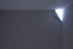 sixpenceee:  The above is a wall light that looks as if a corner of a wall were peeling and light was leaking therefrom. (Source) 