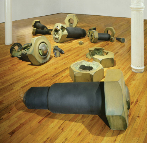 Several large-sized ceramic bolts over a wood floor