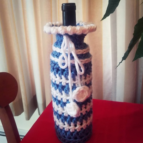 I crocheted this wine cozy as a Christmas gift for my mother-in-law. Turned out pretty good, if I ma