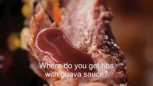94% sure it's a close up of food. Caption: Where do you get ribs with guava sauce?