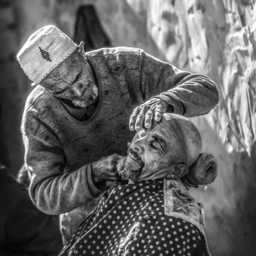 Portraits of ethnic Tajik, Kazakh, Russian, Uyghur, and Kyrgyz men in various hats in Xinjiang.Photo