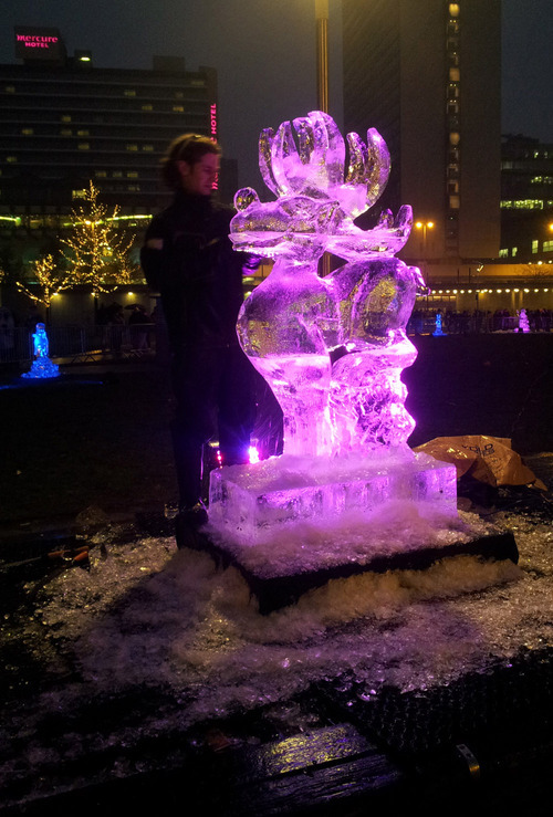 Ice carving in Piccadilly Gardens, Manchester. The LED backlighting helps and helps to show off some