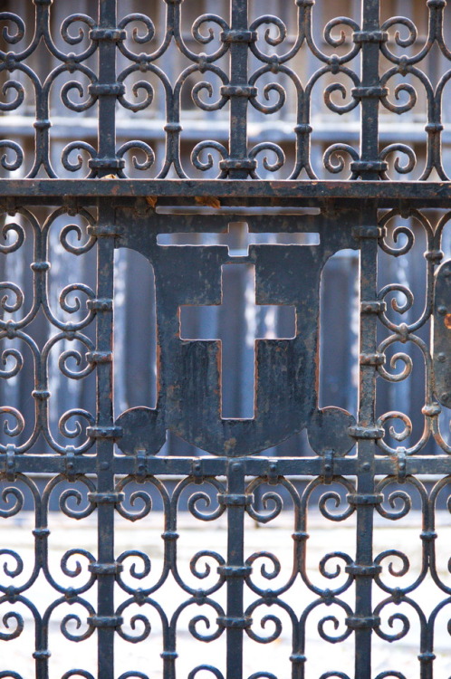 Facing the cross.Detail of a gate at Rhodes Museum, 2013.