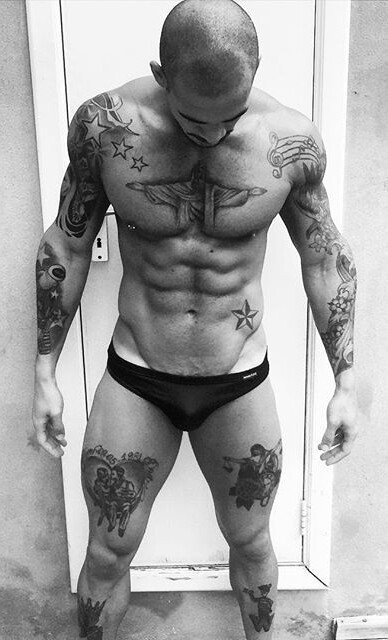 dominicanblackboy:  A sexy moment in black and white wit gorgeous tatted stud Wally Couto!😍