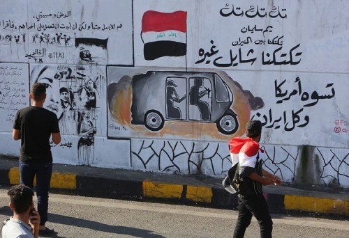 Murals celebrating Iraq&rsquo;s tuk-tuk drivers who have been helping protesters in Baghdad&rsquo;s 