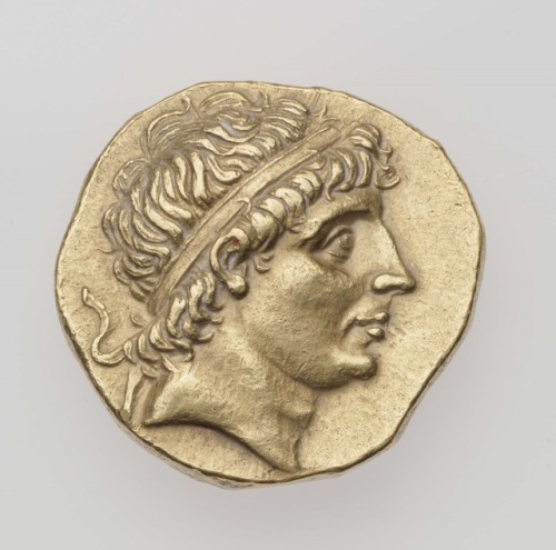 Stater of Kingdom of Syria with head of Antiochos I Soter (obverse) and Apollo seated on a netted om