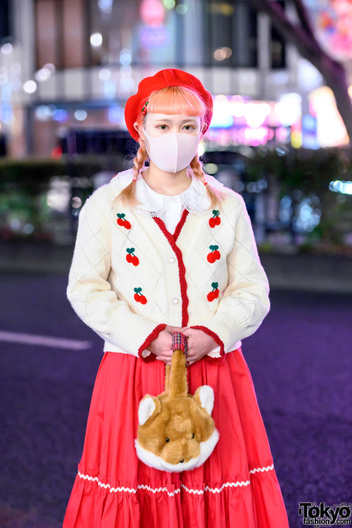 Japanese art college student Akane wearing a cute retro inspired style in Harajuku with a WC top, ch