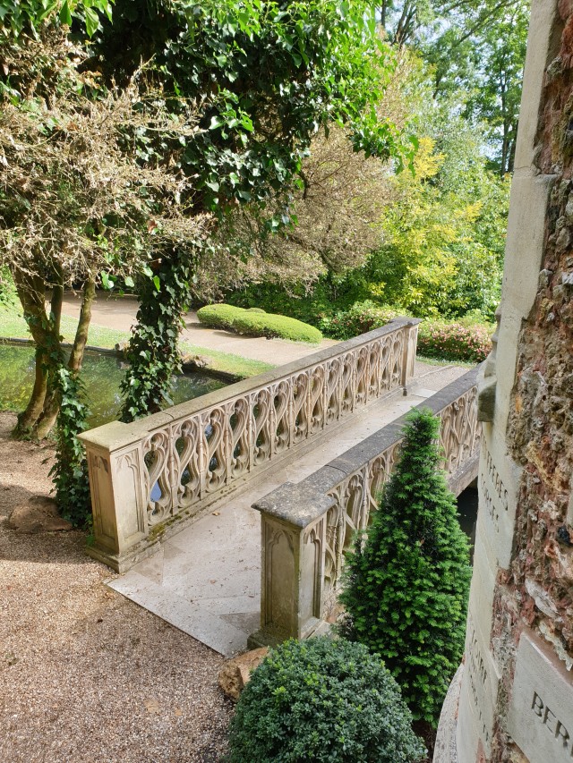 a view from the door of the castle, looking on the elaborate stone carved bridge and the little island the castle stands on