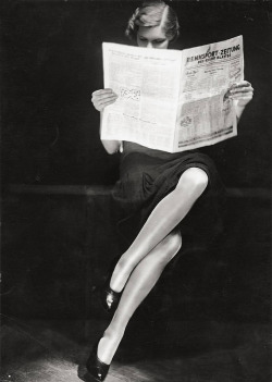  A lady reading newspaper, 1932 
