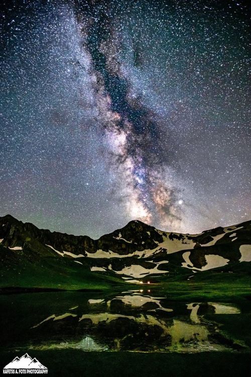 Gorgeous shot of the Milky Way over the Dragon Lake Verlinga, Mount Lakmos in Tríkala, Thessaly, Gre