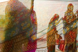 natgeotravel:  Women dry saris along the Ganges river in this photo contest entry.         