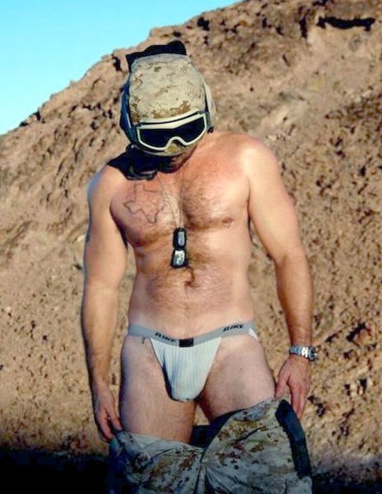 dudeinsea:  Hot body military showing off hairy torso and great dick strap on