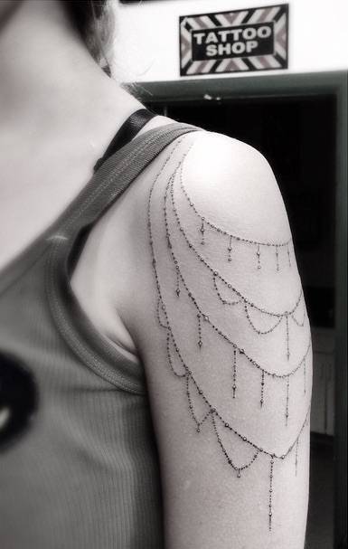 cutelittletattoos:  Ornamental style jewellery piece tattoo on the left shoulder.