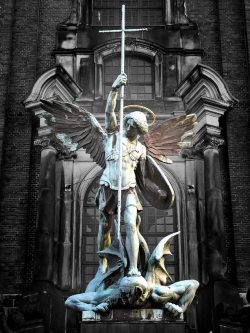 cloudyskiesandcatharsis:  Archangel Michael’s victory over the Devil, sculpture above the main entrance at St. Michaelis Church, Hamburg 