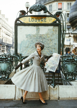 laurasaxby:  Model wearing a Dior suit outside the Louvre Metro station. Photographed by Mark Shaw in Paris in 1957 for LIFE magazine.