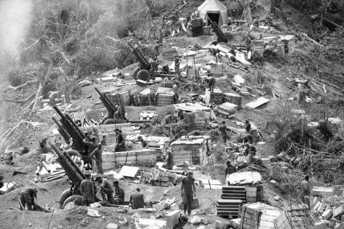 West of Hue, Marine gun crews prepare their 105mm Howitzers for action. February 18, 1969